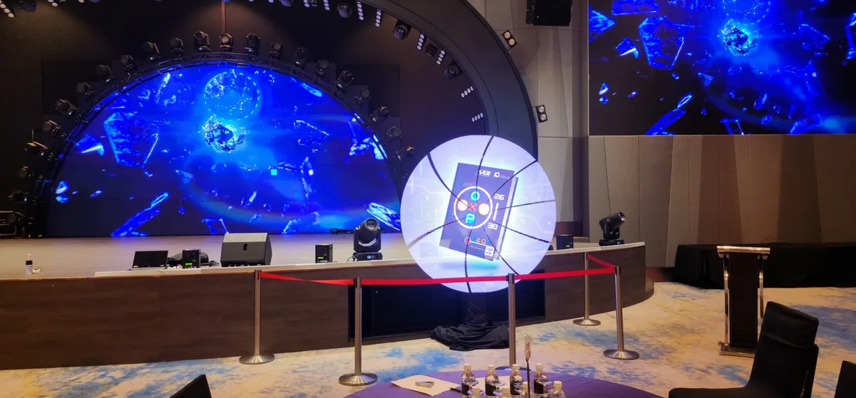 Blue LED screens and moving lights around a launch stage