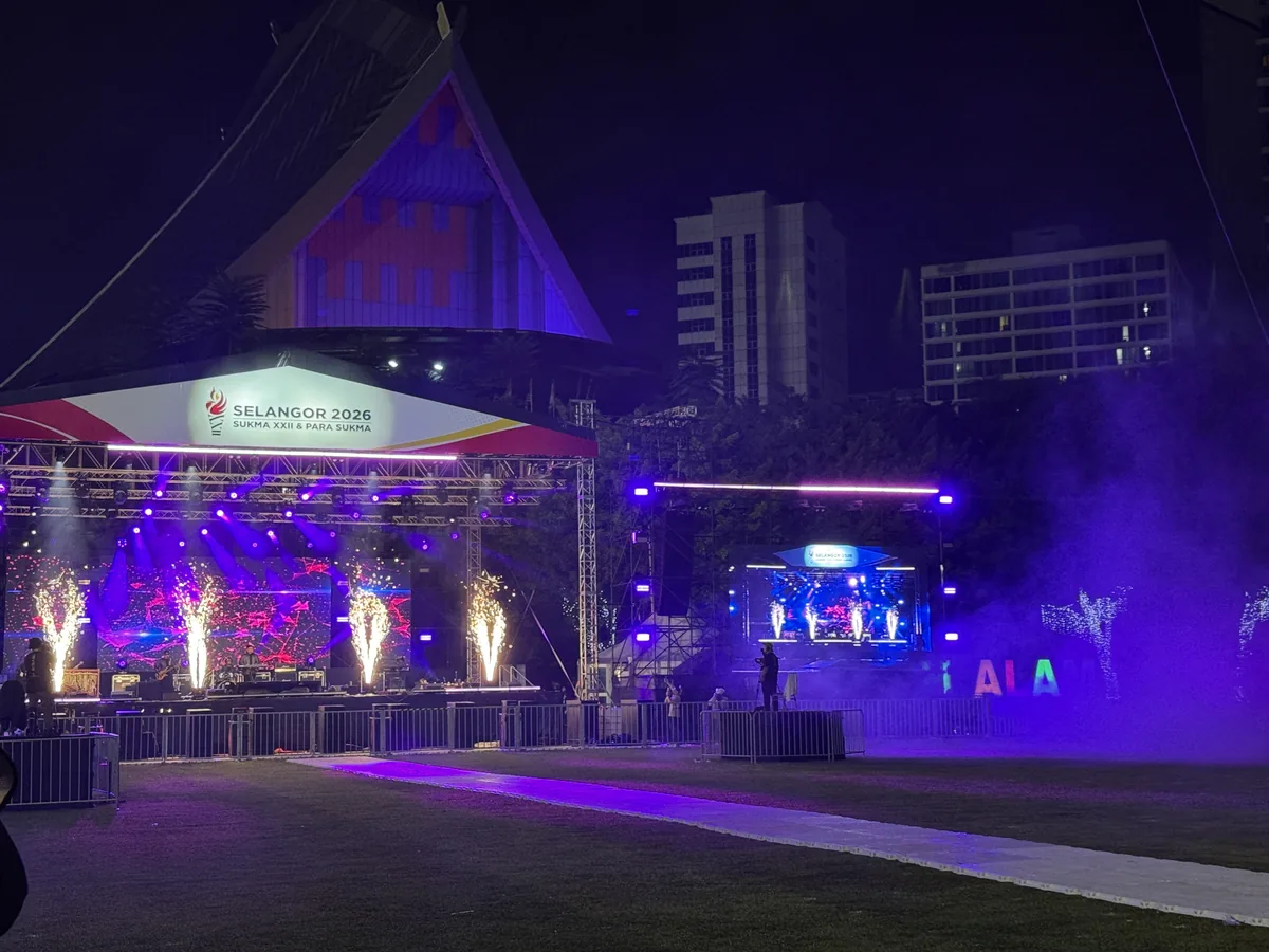 Night stage with cold sparks, smoke and purple lighting